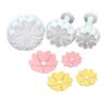 Plunger cutter in the shape of a flower, used for fondant decoration.