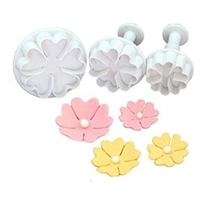 Plunger cutter in the shape of a flower, used for fondant decoration.