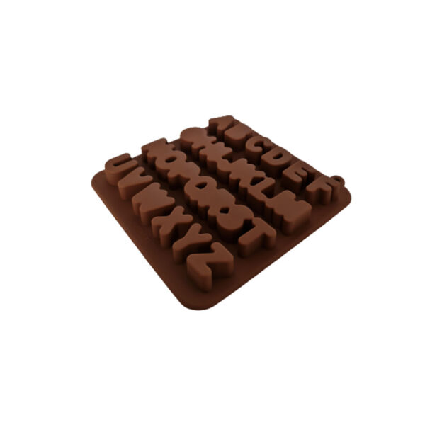 Silicone mold with alphabet-shaped cavities for creating letter-shaped chocolate treats.