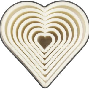 Plastic heart-shaped cutter designed for cutting out heart shapes from various materials, such as dough or paper. Features a simple, rounded heart shape with an easy-to-use handle.