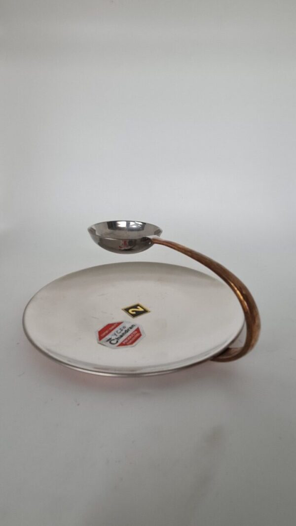 Copper and stainless steel serving dish, ideal for serving and entertaining.