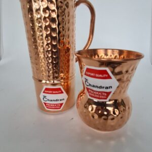 Copper water jug with matching tumbler, traditional Indian drinkware set.