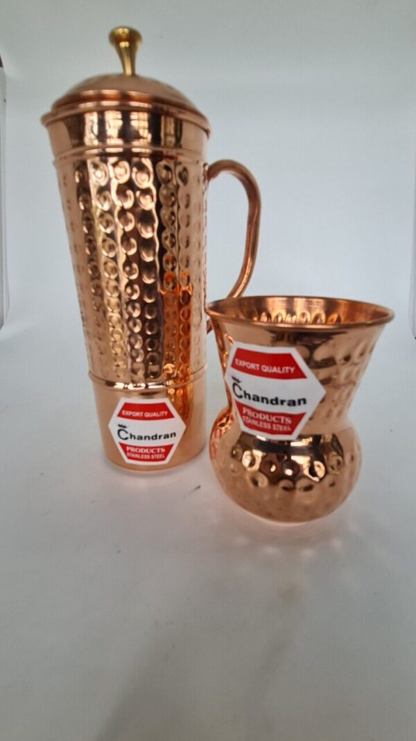 Copper water jug with matching tumbler, traditional Indian drinkware set.