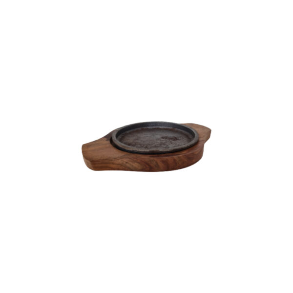 An 5-inch round wooden sizzler plate with a polished surface, ideal for serving small portions of sizzling dishes.