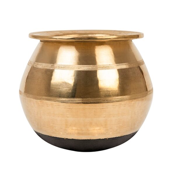 A traditional brass Kunda, used for cooking or serving South Asian dishes.