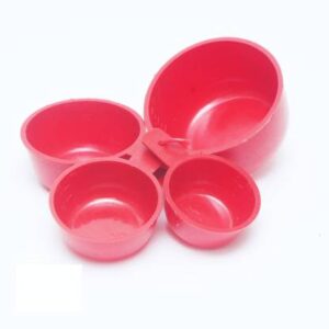 Set of four plastic measuring cups in various sizes, each with a handle and a spout for easy pouring.